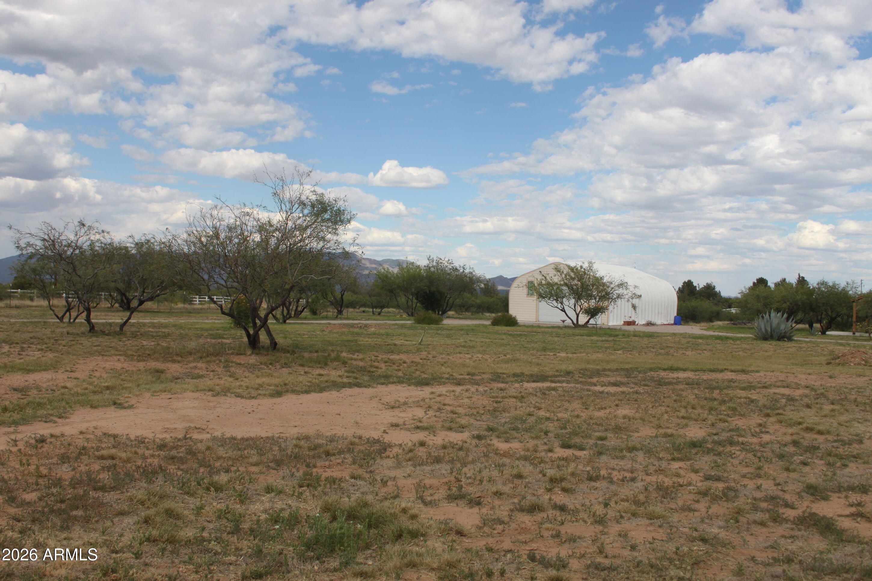10847 South Kings Ranch Road Hereford, AZ 85615 - Photo 39 of 49 a view of a dry yard with trees