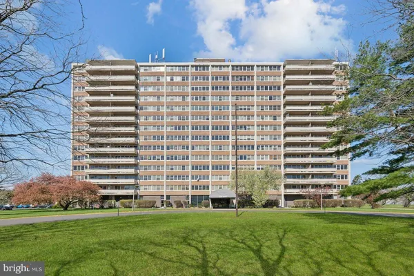 a front view of a building with an outdoor space