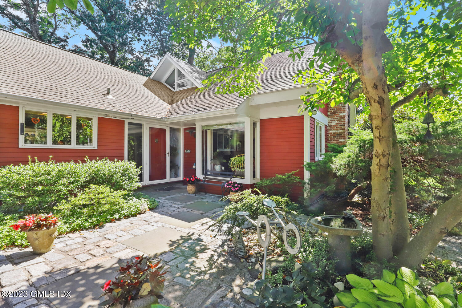 a front view of a house with garden
