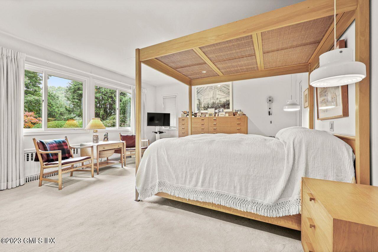 236 Riverside Avenue Riverside, CT 06878 - Photo 18 of 40 a bed room with a bed and a chair