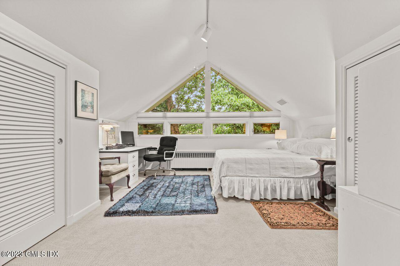 236 Riverside Avenue Riverside, CT 06878 - Photo 24 of 40 a room with a bed and a window