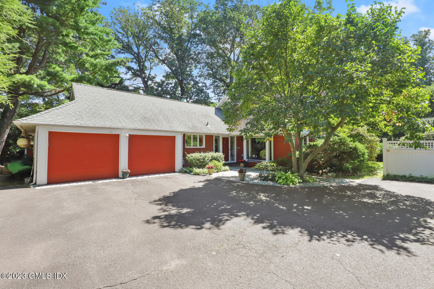 236 Riverside Avenue Riverside, CT 06878 - Photo 3 of 40 a front view of a house with a yard and garage