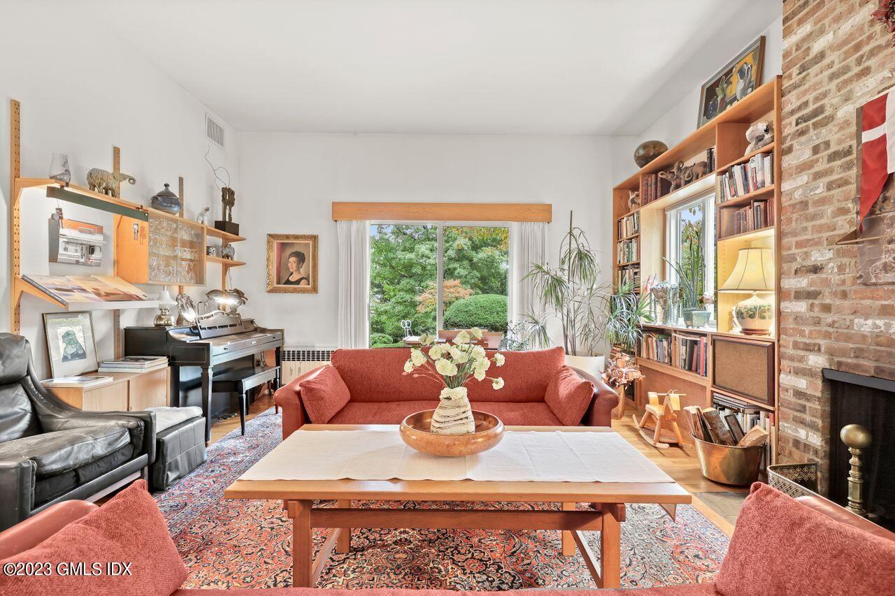 236 Riverside Avenue Riverside, CT 06878 - Photo 10 of 40 a living room with fireplace furniture and a large window