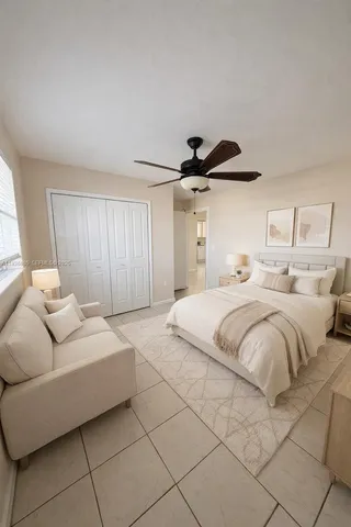 a bedroom with a bed and a couch