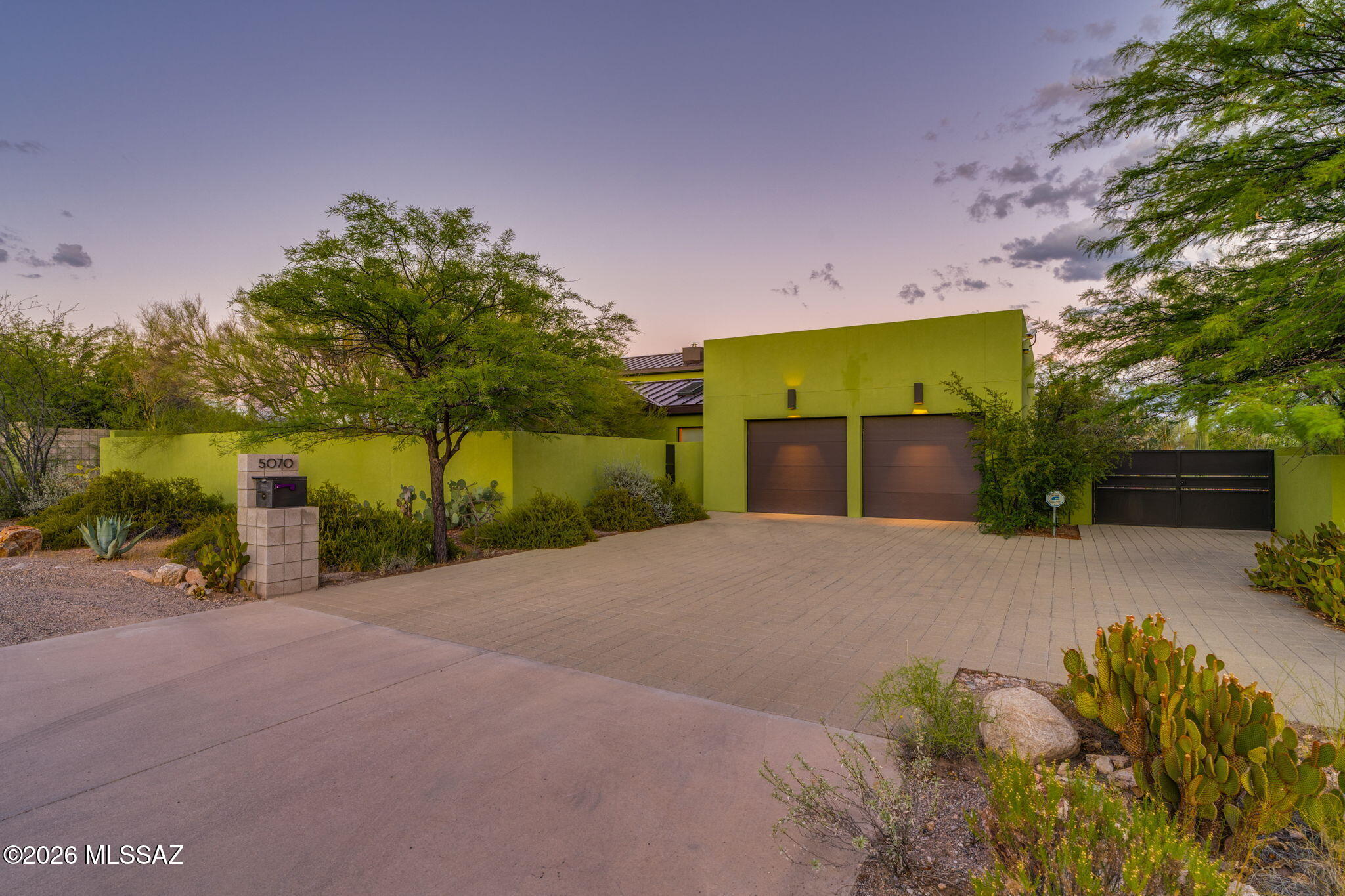 5070 North Valley View Road Tucson, AZ 85718 - Photo 45 of 51 a front view of a house with a yard and a garage