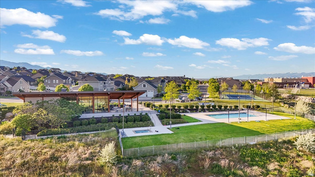 14738 Tangle Hill Road Herriman, UT 84096 - Photo 6 of 66 Community clubhouse with a contemporary design, outdoor swimming pool, and dedicated tennis courts