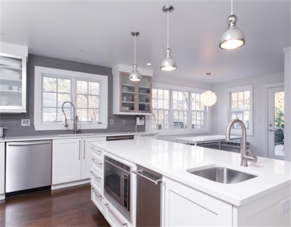 26 Whitney Road Newton, MA 02460 - Photo 11 of 29 a kitchen with granite countertop a sink a counter space appliances and cabinets