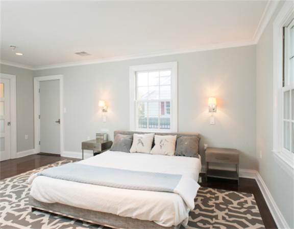 26 Whitney Road Newton, MA 02460 - Photo 13 of 29 a bedroom with a bed and wooden floor