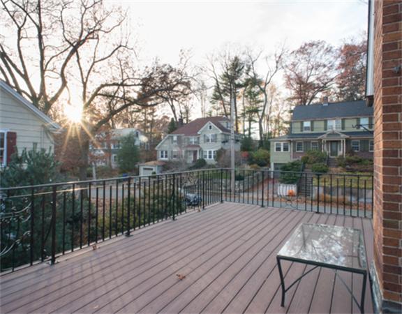 26 Whitney Road Newton, MA 02460 - Photo 16 of 29 a balcony with wooden floor and fence