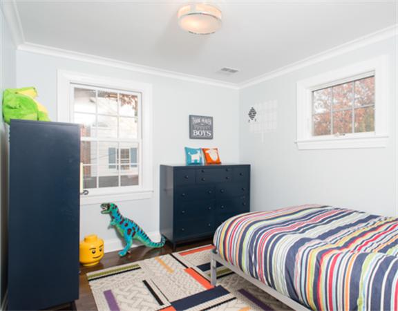 26 Whitney Road Newton, MA 02460 - Photo 18 of 29 a bedroom with a bed and a window