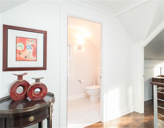 26 Whitney Road Newton, MA 02460 - Photo 20 of 29 a bathroom with a toilet a sink and a mirror