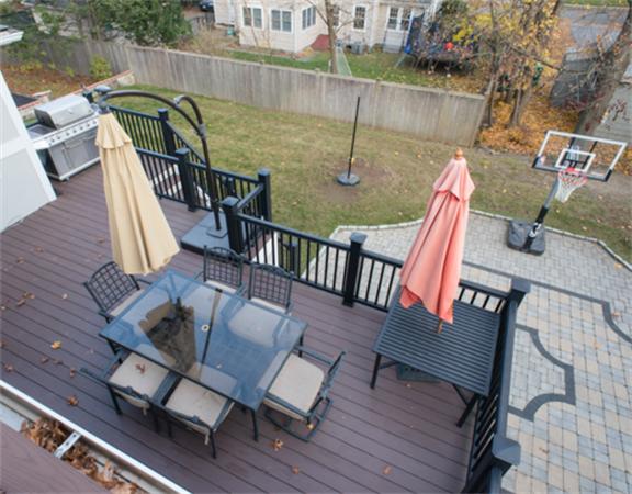 26 Whitney Road Newton, MA 02460 - Photo 2 of 29 a view of deck with patio table and chairs