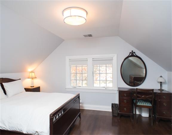 26 Whitney Road Newton, MA 02460 - Photo 22 of 29 a bedroom with bed and a mirror