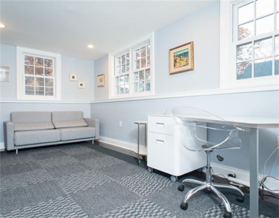 26 Whitney Road Newton, MA 02460 - Photo 24 of 29 a living room with furniture and a window