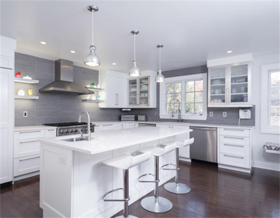 26 Whitney Road Newton, MA 02460 - Photo 9 of 29 a kitchen with a stove a sink a center island and cabinets