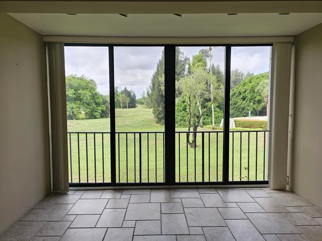 a view of a room with a large window