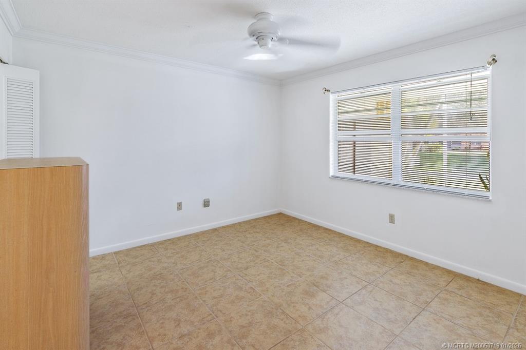 1909 Southwest Palm City Road, Unit B Stuart, FL 34994 - Photo 12 of 36 an empty room with a window