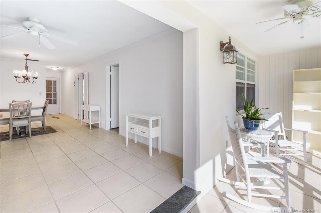 1909 Southwest Palm City Road, Unit B Stuart, FL 34994 - Photo 14 of 36 a living room with furniture a dining table and chairs