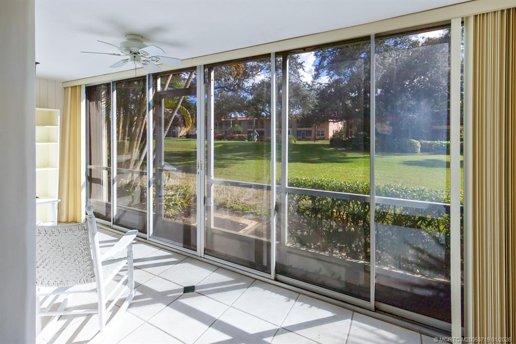 1909 Southwest Palm City Road, Unit B Stuart, FL 34994 - Photo 17 of 36 a view of a room with sliding glass door