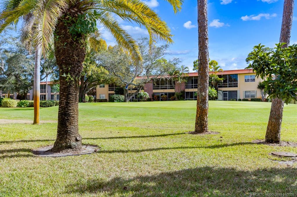 1909 Southwest Palm City Road, Unit B Stuart, FL 34994 - Photo 24 of 36 a view of a garden with palm trees