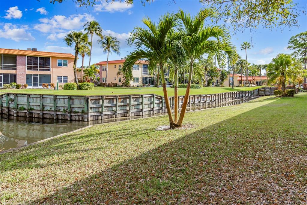 1909 Southwest Palm City Road, Unit B Stuart, FL 34994 - Photo 27 of 36 a view of swimming pool with outdoor seating and yard