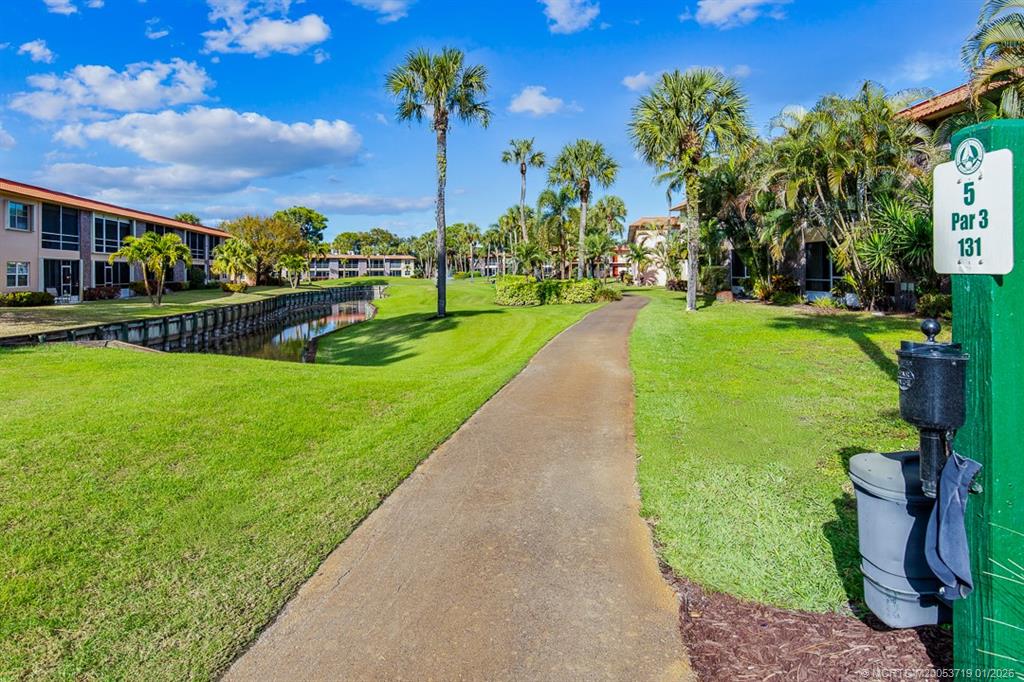 1909 Southwest Palm City Road, Unit B Stuart, FL 34994 - Photo 29 of 36 a view of a garden with houses