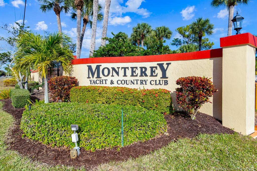 1909 Southwest Palm City Road, Unit B Stuart, FL 34994 - Photo 31 of 36 a sign on the side of the road