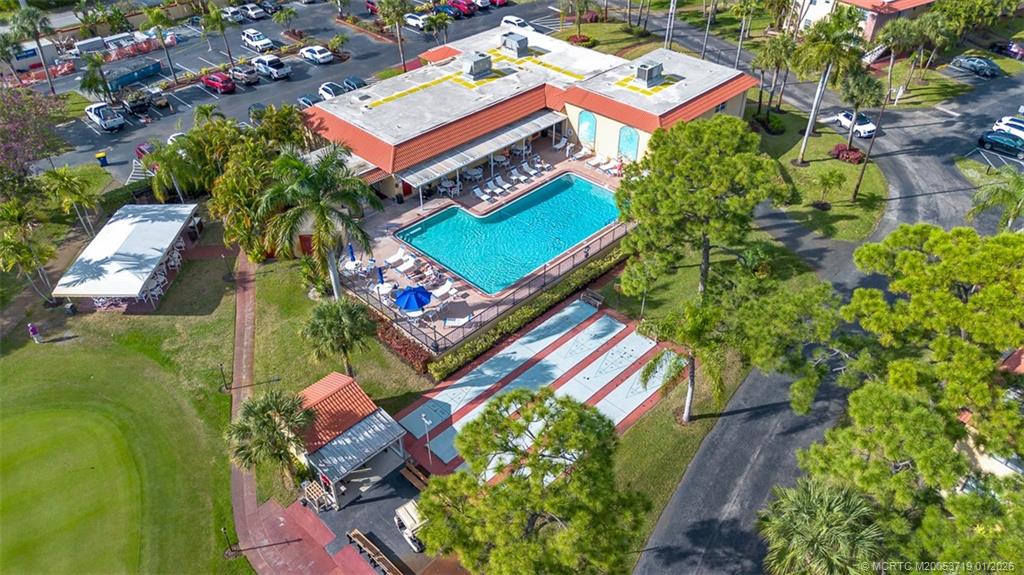 1909 Southwest Palm City Road, Unit B Stuart, FL 34994 - Photo 4 of 36 an aerial view of a house with a yard and garden
