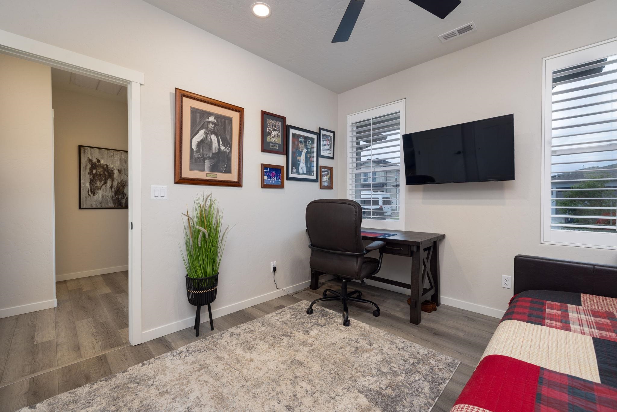 2454 Ross Road Grand Junction, CO 81505 - Photo 11 of 31 a view of a livingroom with workspace and a window