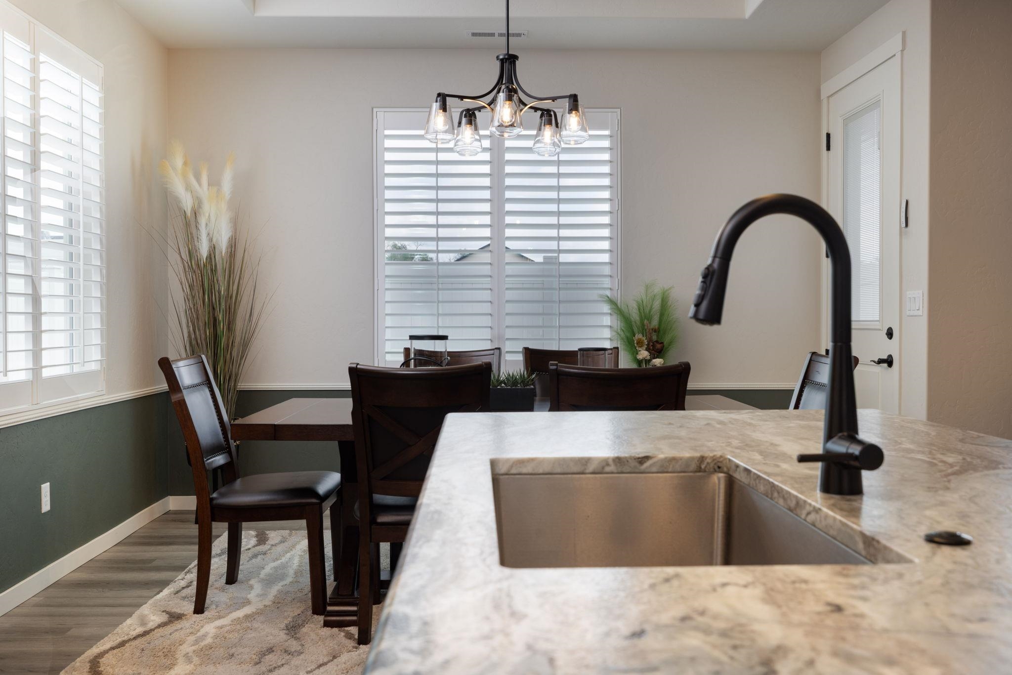 2454 Ross Road Grand Junction, CO 81505 - Photo 16 of 31 a kitchen with a refrigerator and a sink