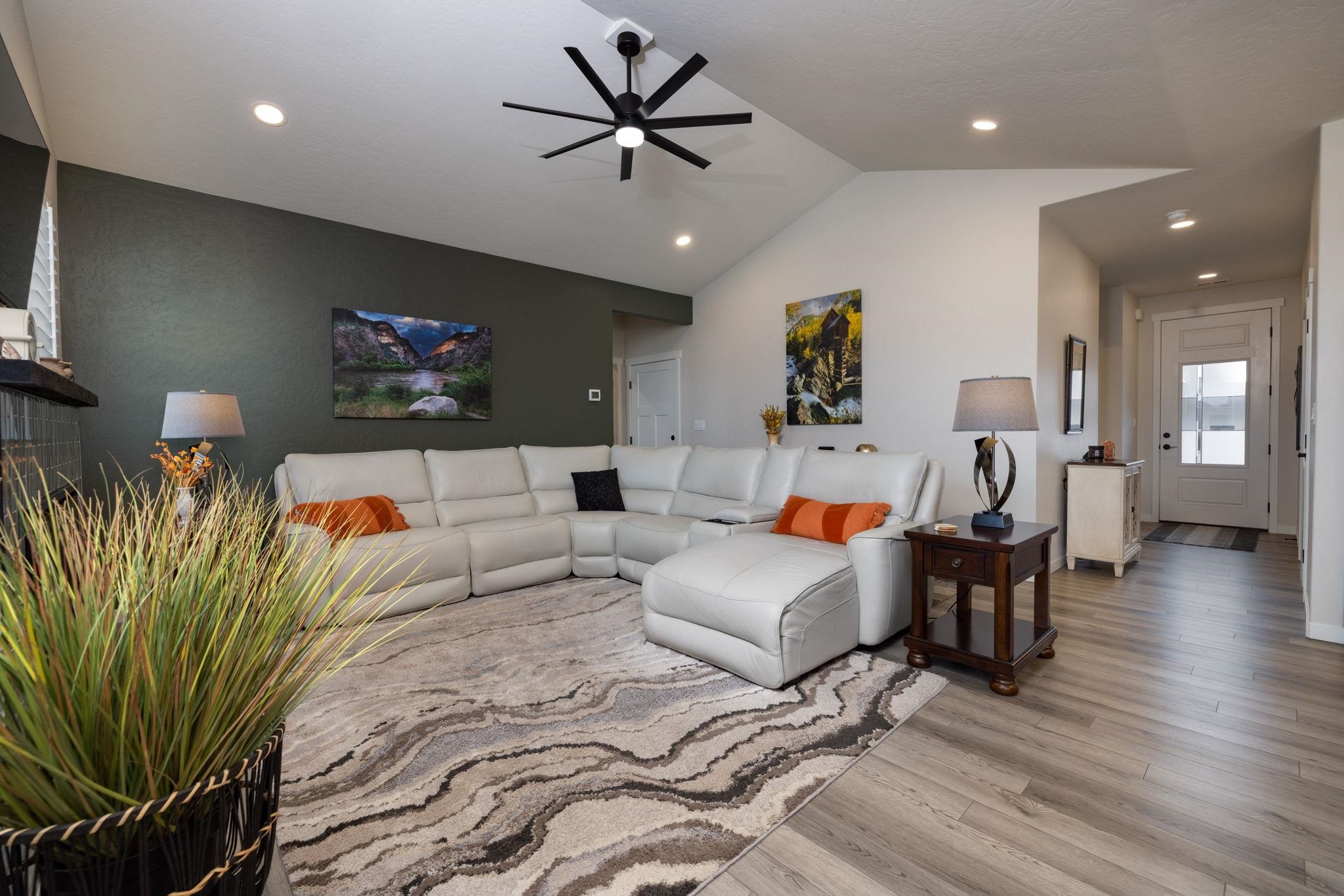 2454 Ross Road Grand Junction, CO 81505 - Photo 18 of 31 a living room with furniture and a flat screen tv