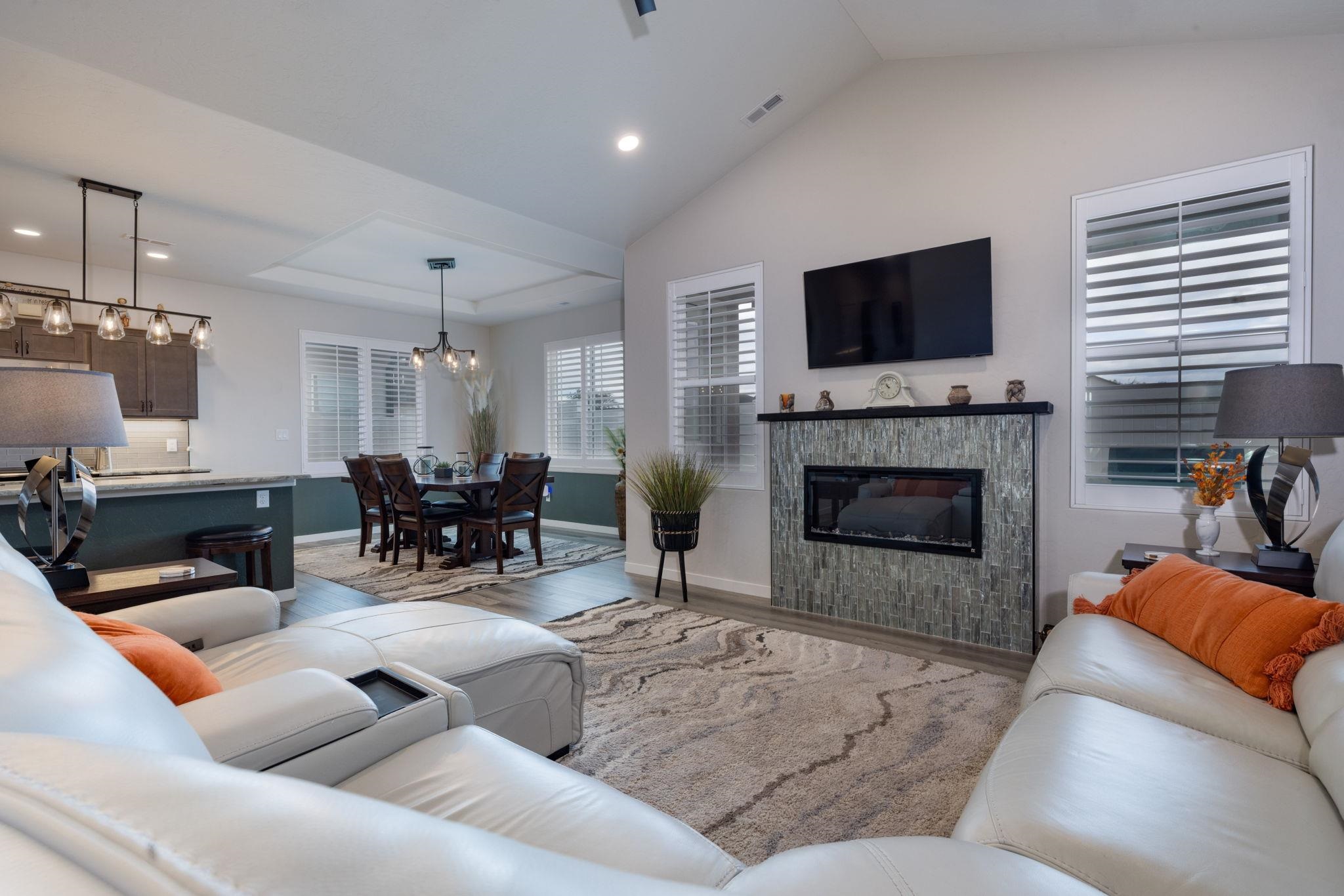2454 Ross Road Grand Junction, CO 81505 - Photo 20 of 31 a living room with furniture fireplace and flat screen tv