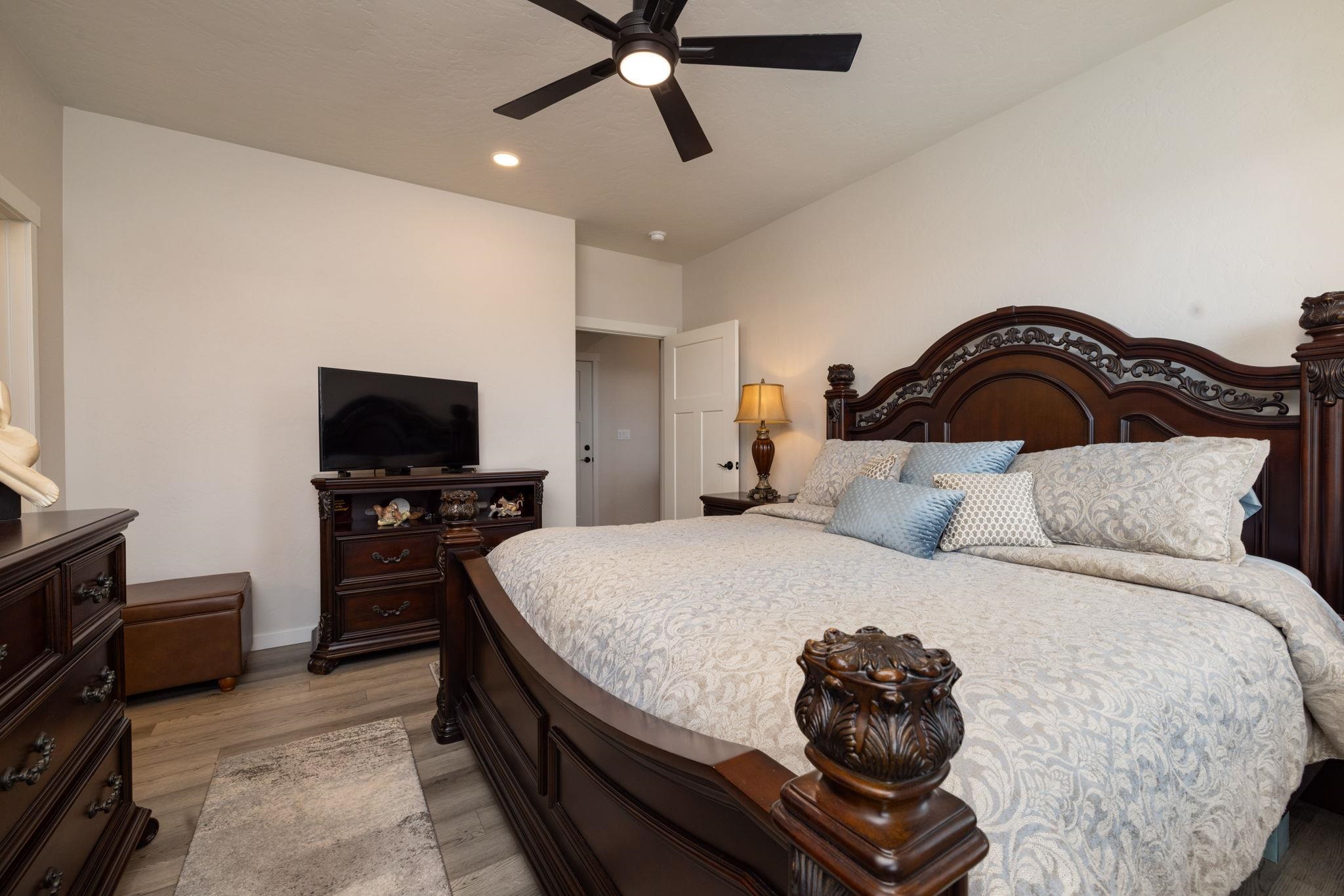 2454 Ross Road Grand Junction, CO 81505 - Photo 24 of 31 a bedroom with a bed and a television