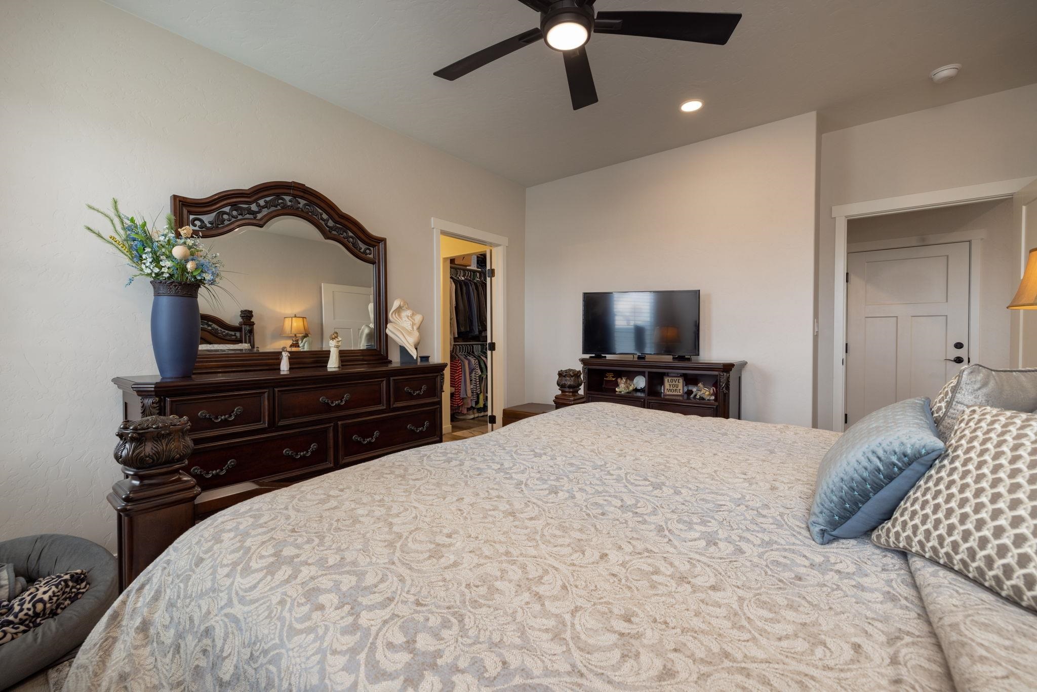 2454 Ross Road Grand Junction, CO 81505 - Photo 25 of 31 a bedroom with a bed and a television