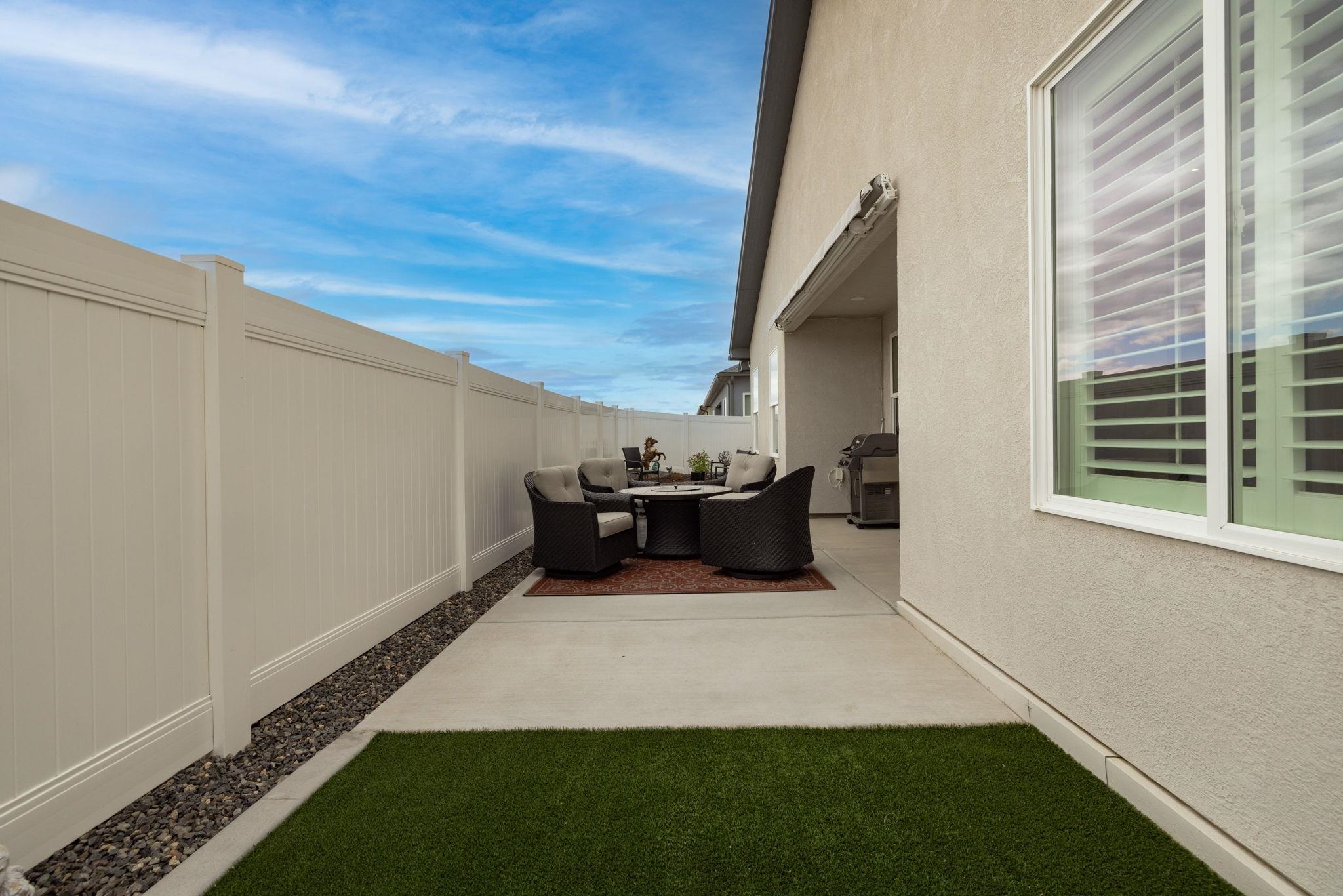 2454 Ross Road Grand Junction, CO 81505 - Photo 28 of 31 a view of an empty room with a fireplace and a window