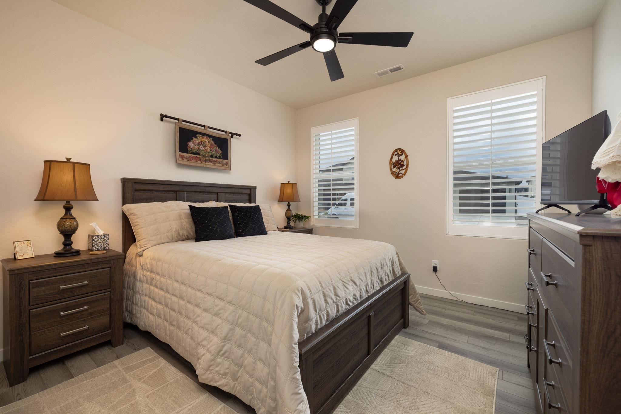 2454 Ross Road Grand Junction, CO 81505 - Photo 4 of 31 a bedroom with a bed and a tv