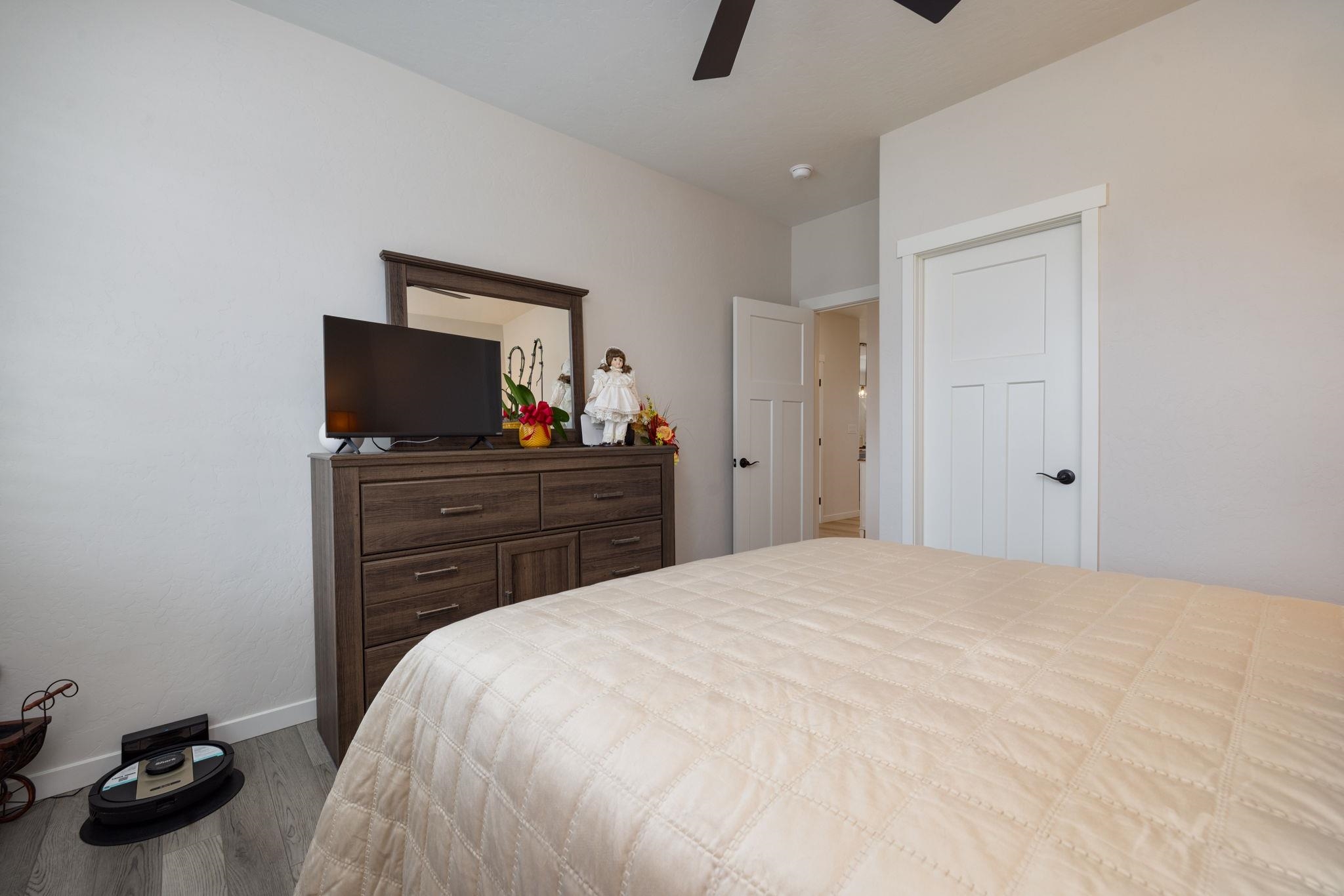 2454 Ross Road Grand Junction, CO 81505 - Photo 6 of 31 a bedroom with a bed and a flat screen tv