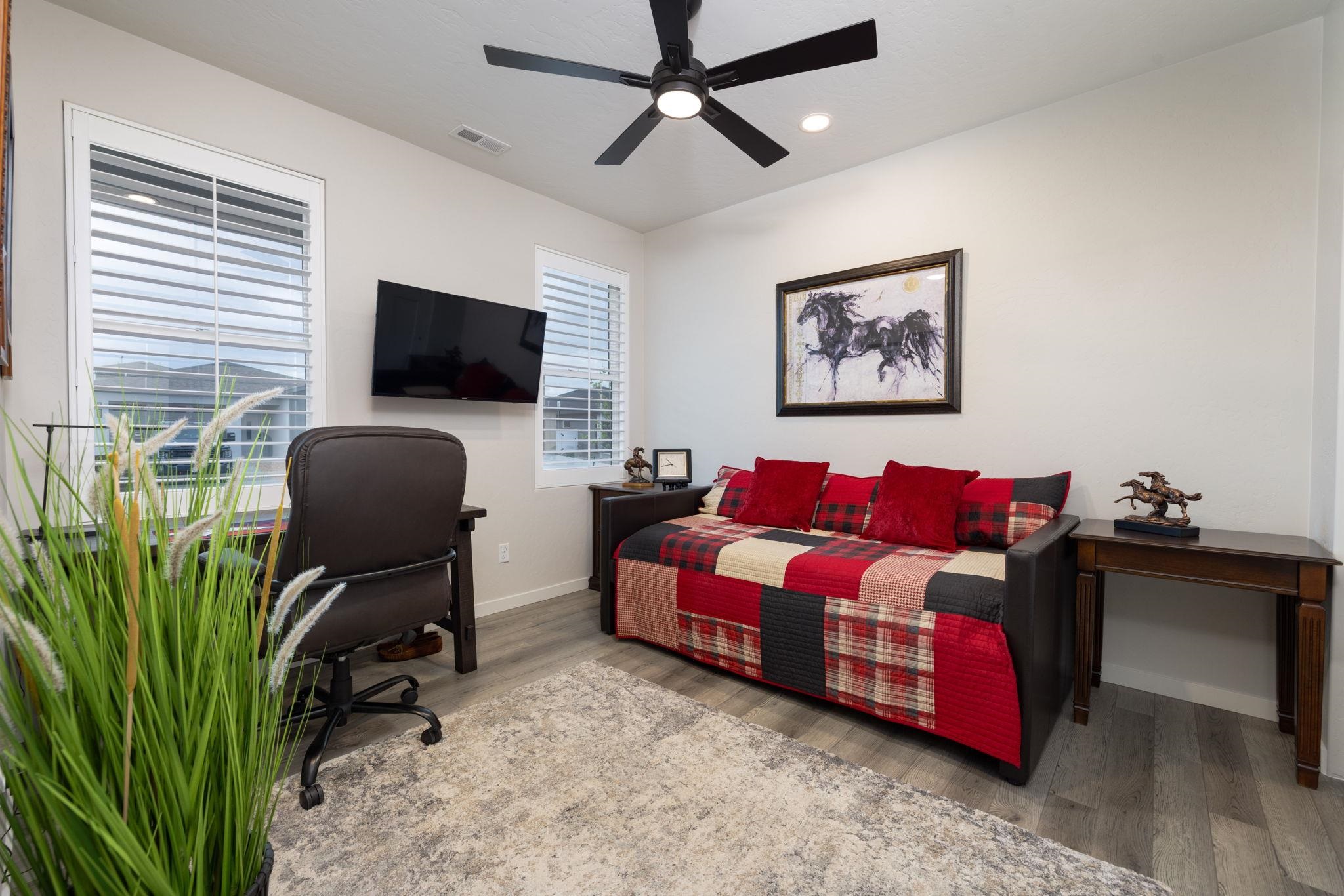 2454 Ross Road Grand Junction, CO 81505 - Photo 10 of 31 a living room with furniture and a flat screen tv