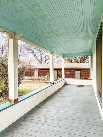 a view of a building with a porch