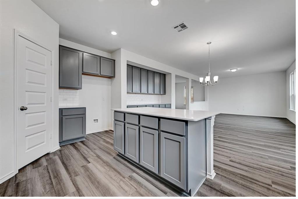 4553 Dugenta Place Round Rock, TX 78665 - Photo 18 of 38 a bathroom with a sink and a mirror