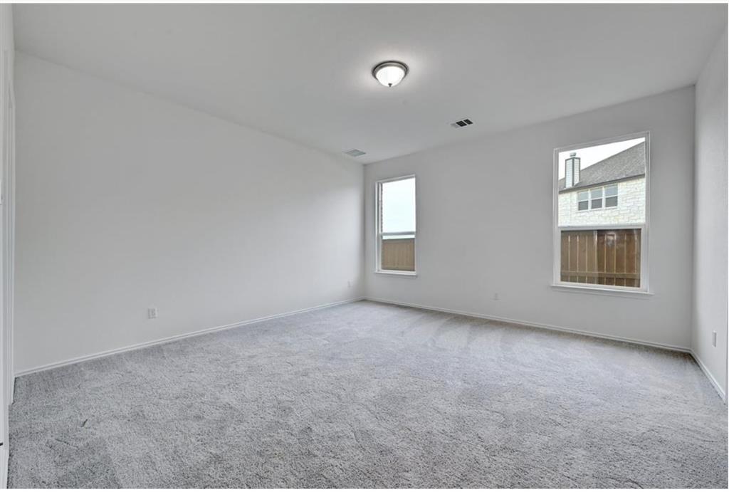 4553 Dugenta Place Round Rock, TX 78665 - Photo 22 of 38 an empty room with windows
