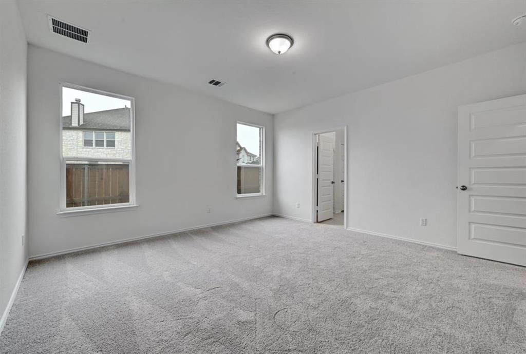 4553 Dugenta Place Round Rock, TX 78665 - Photo 23 of 38 an empty room with windows