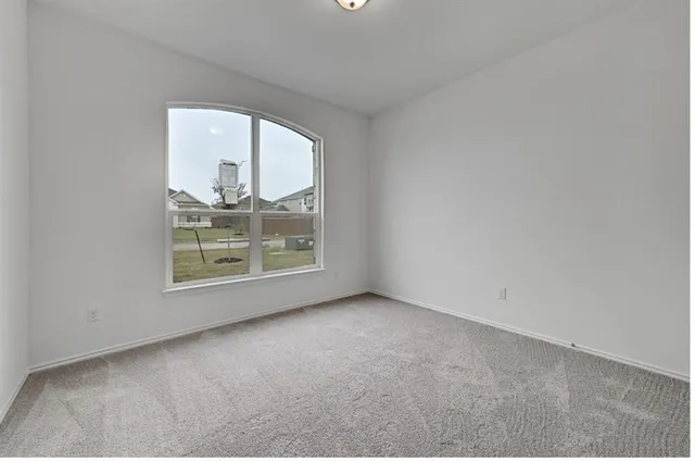 a view of a room that has a window in it