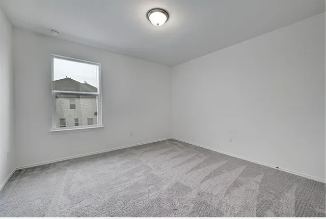a bathroom with a double vanity sink mirror and toilet