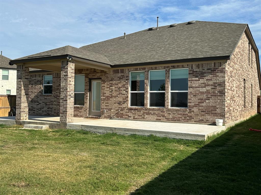 4553 Dugenta Place Round Rock, TX 78665 - Photo 38 of 38 a front view of a house with a garden