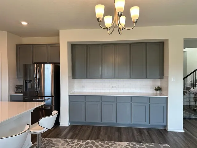 a kitchen with a sink and cabinets
