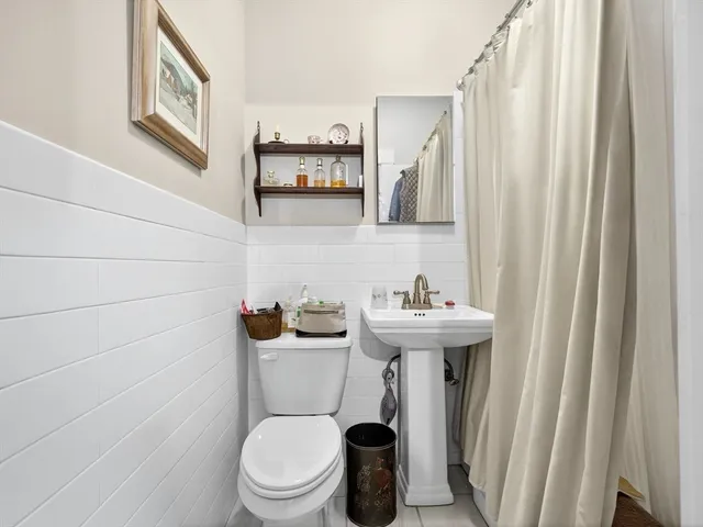 a street sign on a pole on a street