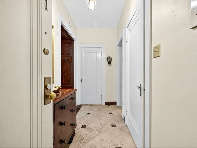 a living room with furniture and large windows