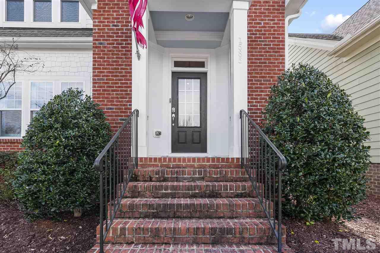 1585 Fullerton Place Raleigh, NC 27607 - Photo 2 of 30 a front view of a house with a garden
