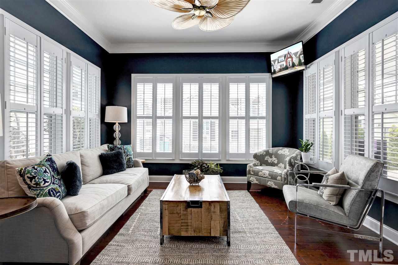 1585 Fullerton Place Raleigh, NC 27607 - Photo 15 of 30 a living room with furniture and large windows